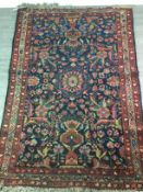 A SAROUK BORDERED RUG