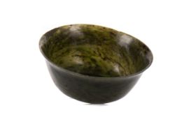 A 19TH CENTURY CHINESE SPINACH JADE CIRCULAR BOWL