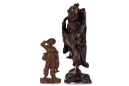 A CHINESE CARVED WOOD FIGURE OF A FISHERMAN