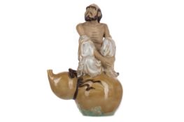 A CHINESE POTTERY FIGURE