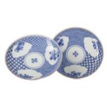 A PAIR OF JAPANESE ARITA BLUE AND WHITE CIRCULAR PLAQUES