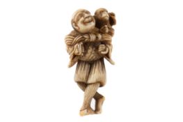 A JAPANESE IVORY NETSUKE