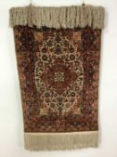 A PERSIAN SILK PRAYER MAT