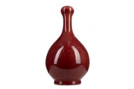 A CHINESE SANG DE BOEUF GLAZED BALUSTER VASE