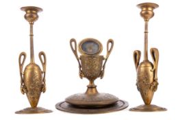 A 19TH CENTURY FRANCO-PERSIAN BRONZE GARNITURE OF AN INKSTAND AND TWO CANDLESTANDS