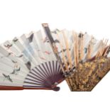 A NINETEENTH CENTURY CHINESE LACQUERED AND GILT FAN, AND A FURTHER FAN