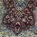 A PERSIAN KIRMAN RUG