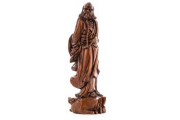 A CHINESE CARVED BOXWOOD BUDDHIST FIGURE