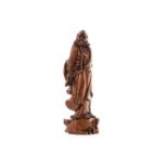 A CHINESE CARVED BOXWOOD BUDDHIST FIGURE