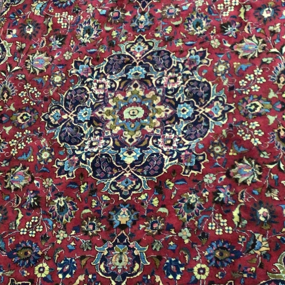 A PERSIAN MESHED RUG