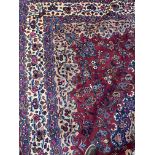 A PERSIAN MESHED RUG