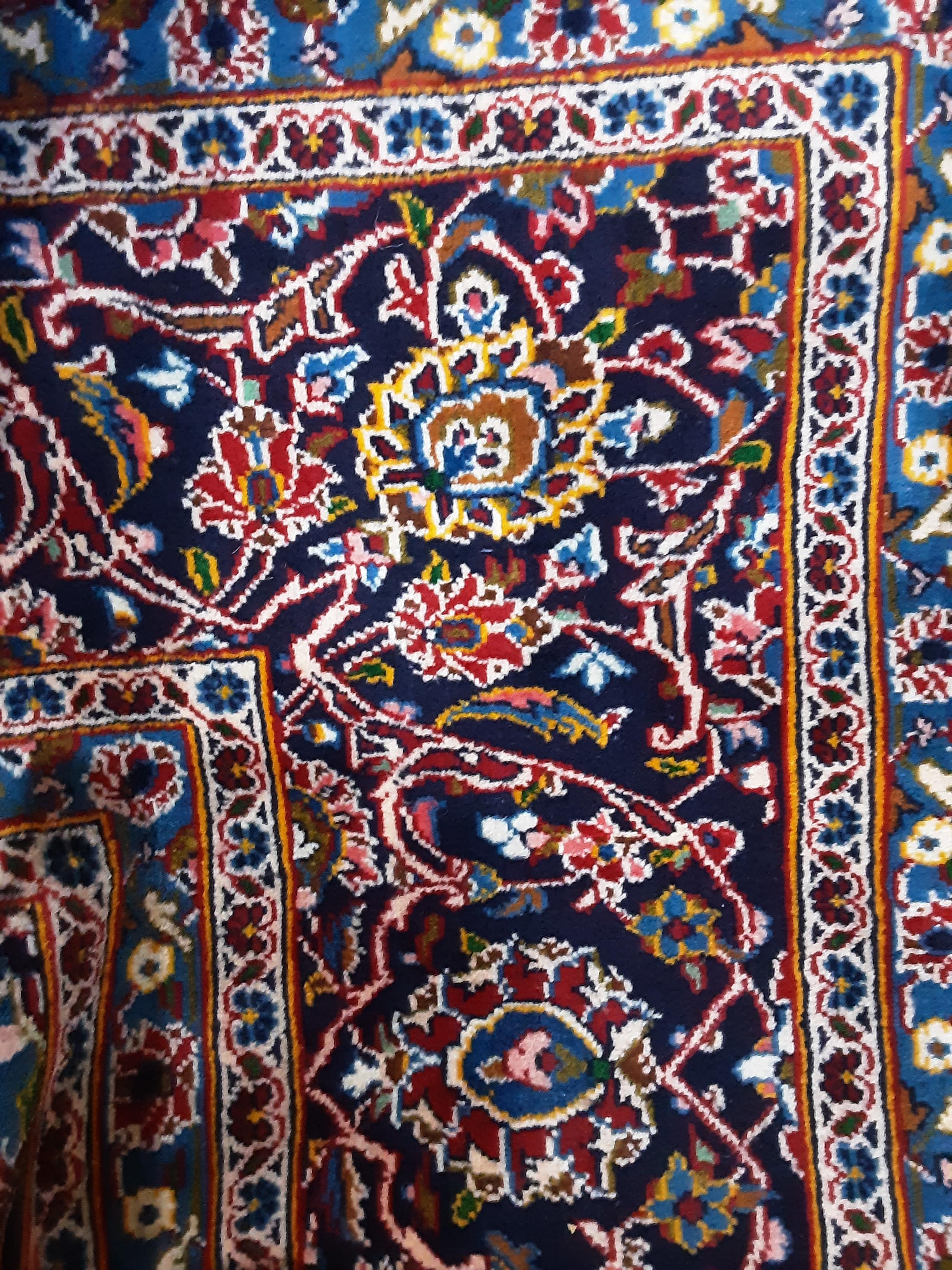 A PERSIAN KASHAN RUG