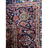 A PERSIAN KASHAN RUG