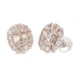 A PAIR OF DIAMOND CLUSTER EARRINGS