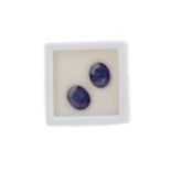 **TWO UNMOUNTED GLASS FILLED SAPPHIRES