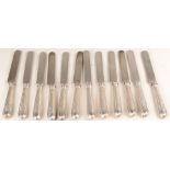 A set of (12) table knives with silver handles, English 19t