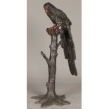 A dark patinated and partly cold painted bronze depicting a