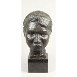 A bronze portrait of a young man. H.: 41 cm. incl. sokkel.