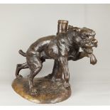 A dark patinated brond depicting a fighting dog on a chain.