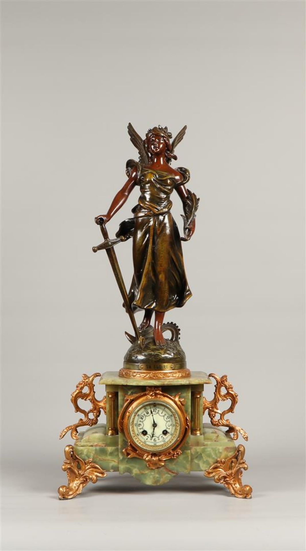 A green marble mantel clock with zamac sculpture "la Gloire