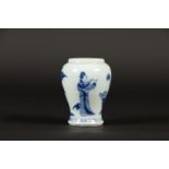 A porcelain tea caddy with decoration of 2x standing frames