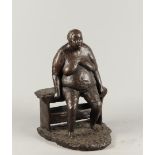 A dark patinated bronze statue of a voluptuous lady on a be