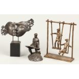 and three decorative bronze statuettes of rockers, two head