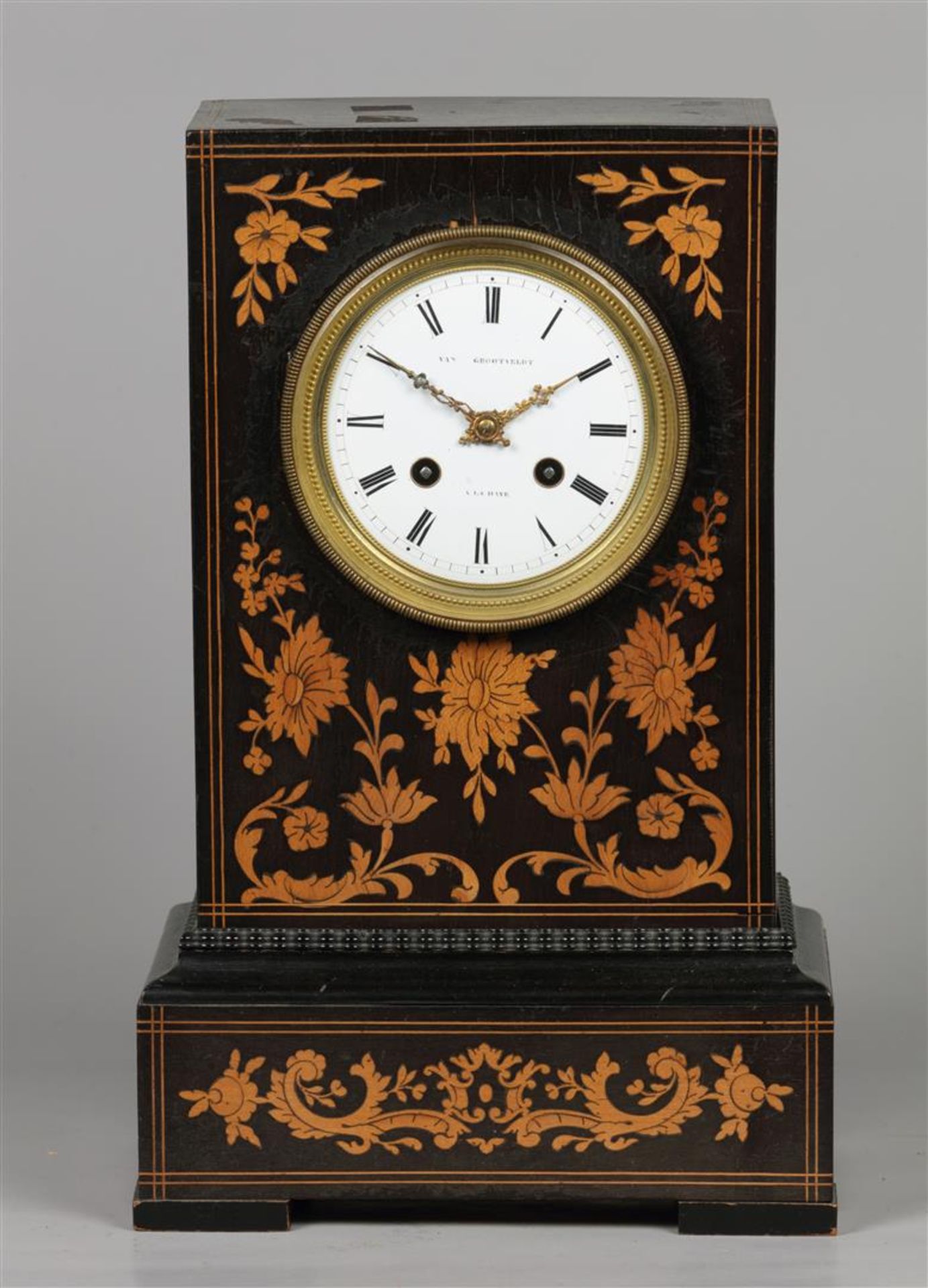 A mahogany veneered mantel clock with fruit wood inlay, ena