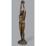 A life-size bronze fountain of a naked lady with a lotus fl