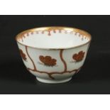 A porcelain cup with a gilded flowerbed decoration with but