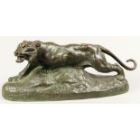 An Art Deco style bronze statue of a prowling lioness. 20th