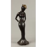 A contemporary bronze of a lady in hiking outfit. H.: 55 cm