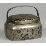 A bronze hand warmer decorated with enamel. China, late 19t