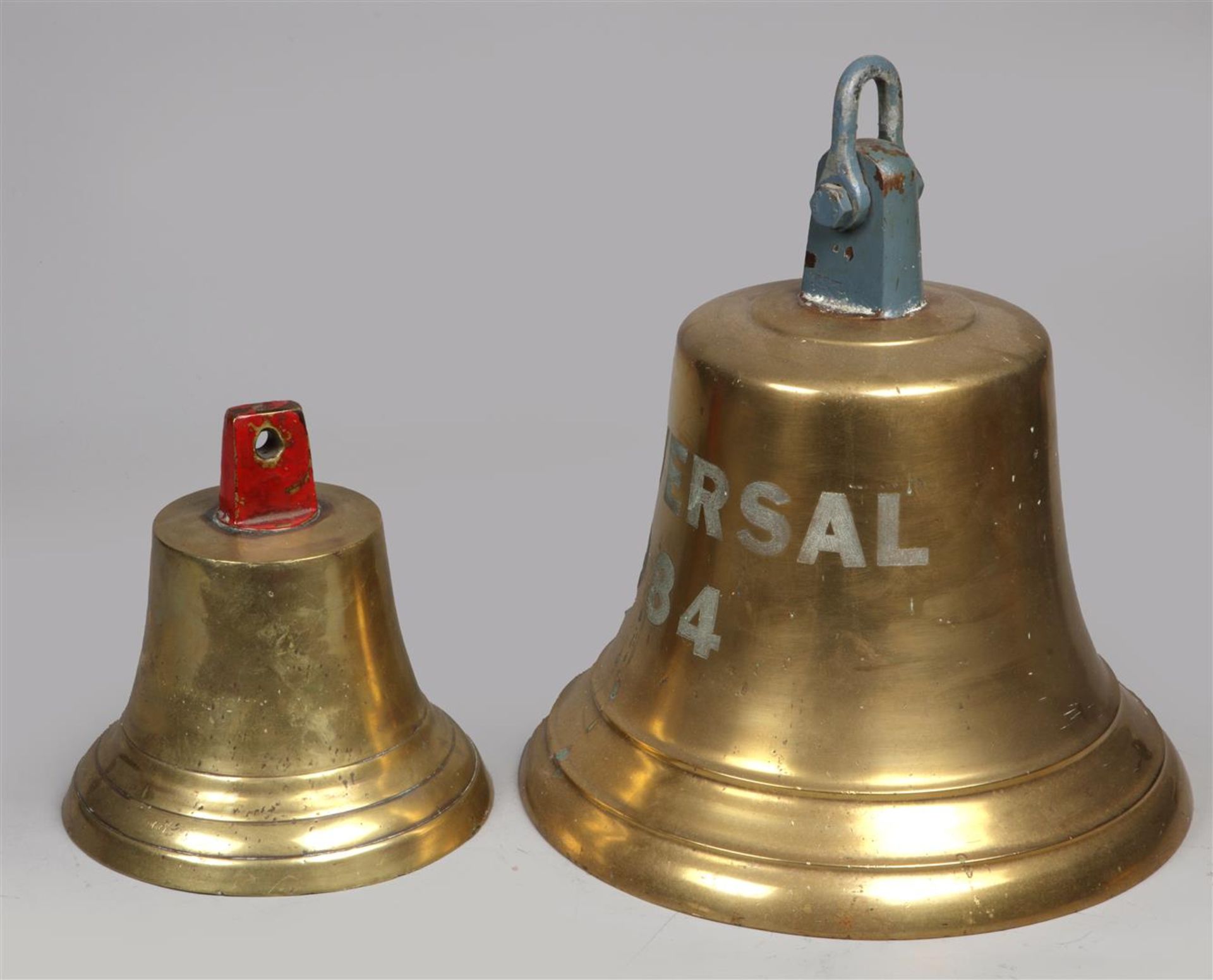 A lot consisting of (2) various bronze ship bells with clap