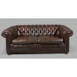 A brown crackle leather Chesterfiel style double sofa, 20th