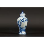 A porcelain vase with lid with flowers on rock decoration C