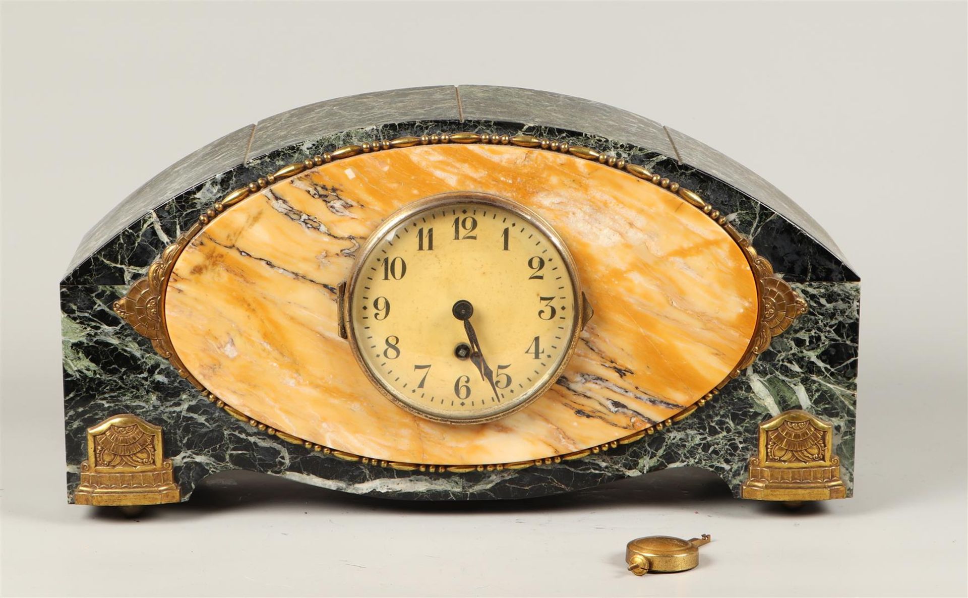 A green marble mantel clock with bronze ornaments. France, 