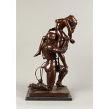 A brown patinated erotic bronze group of a cyborg and a nud
