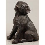 A bronze sculpture of a Labrador puppy, (actual size). Seco