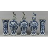 A 5-piece earthenware garniture with floral decor, marked P