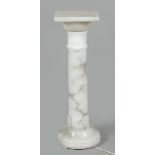 A white marble column / column, built from separate parts.