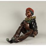 A cold painted bronze of an Italian boy playing mandolin. S