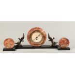 A red marble clock set on a black marble base and zamac scu