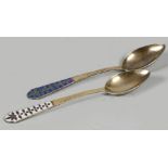 Two Russian gold plated spoons with pearl rim flower decora