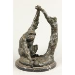 A bronze depicting a chimp near a tree stump. 2nd half of t