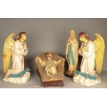 A polychrome plaster group of the Savior in the manger and