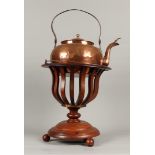 A mahogany tea stove with a copper kettle. ca 1900.