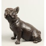 A bronze sculpture of a sitting dog. 2nd half of the 20th c