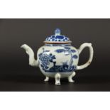 A porcelain teapot on three legs with pine, chrysanthemum a