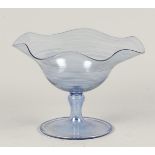 A blue glass vase with a fluted rim, marked on the bottom.